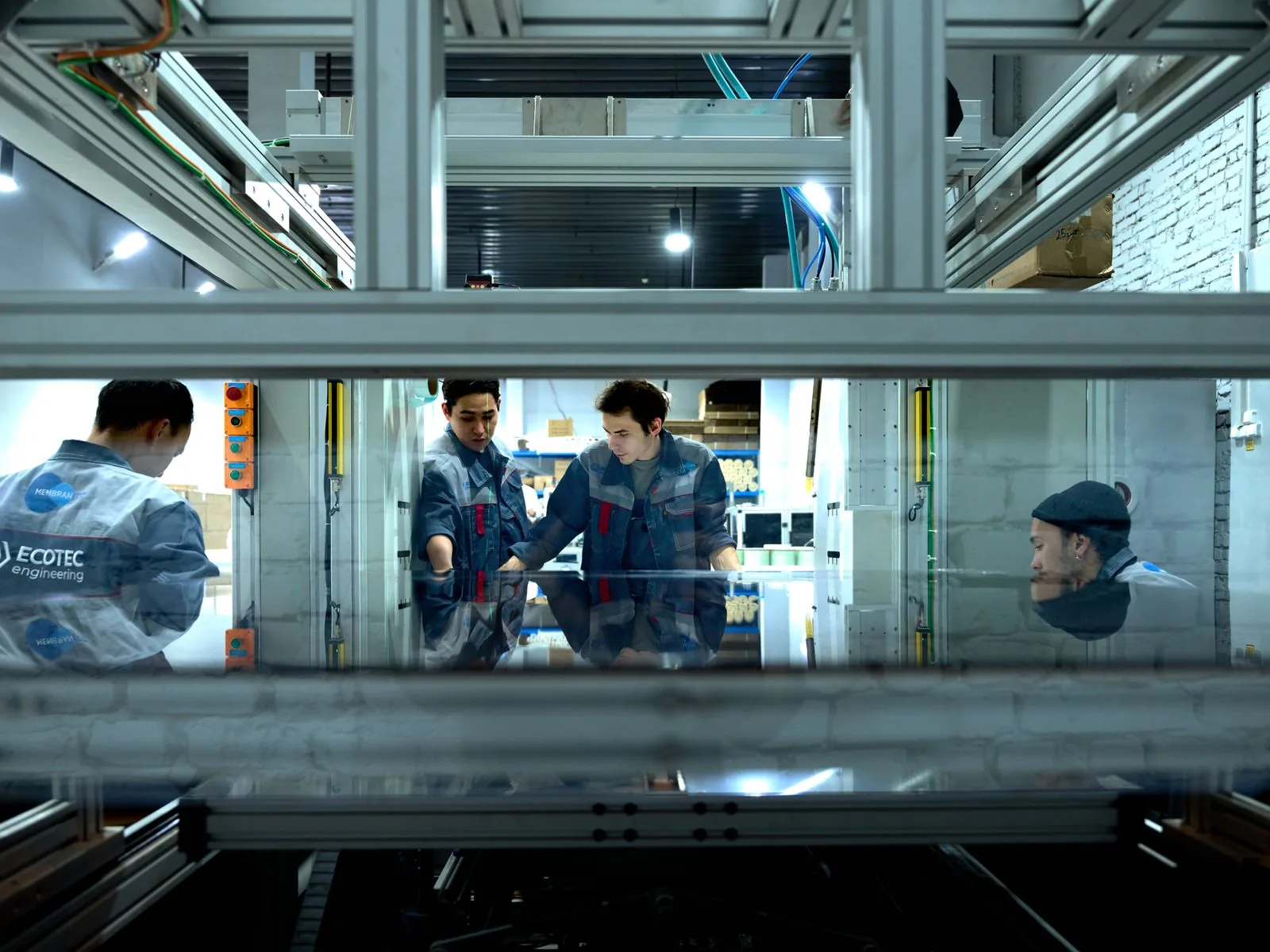 Engineering team collaborating in a technical workspace